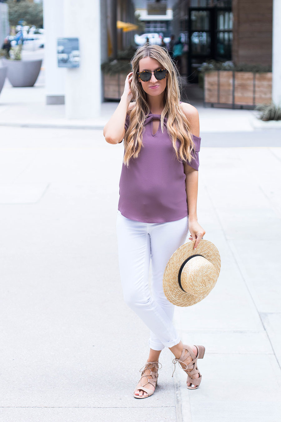 purple off the shoulder top and white jeans 