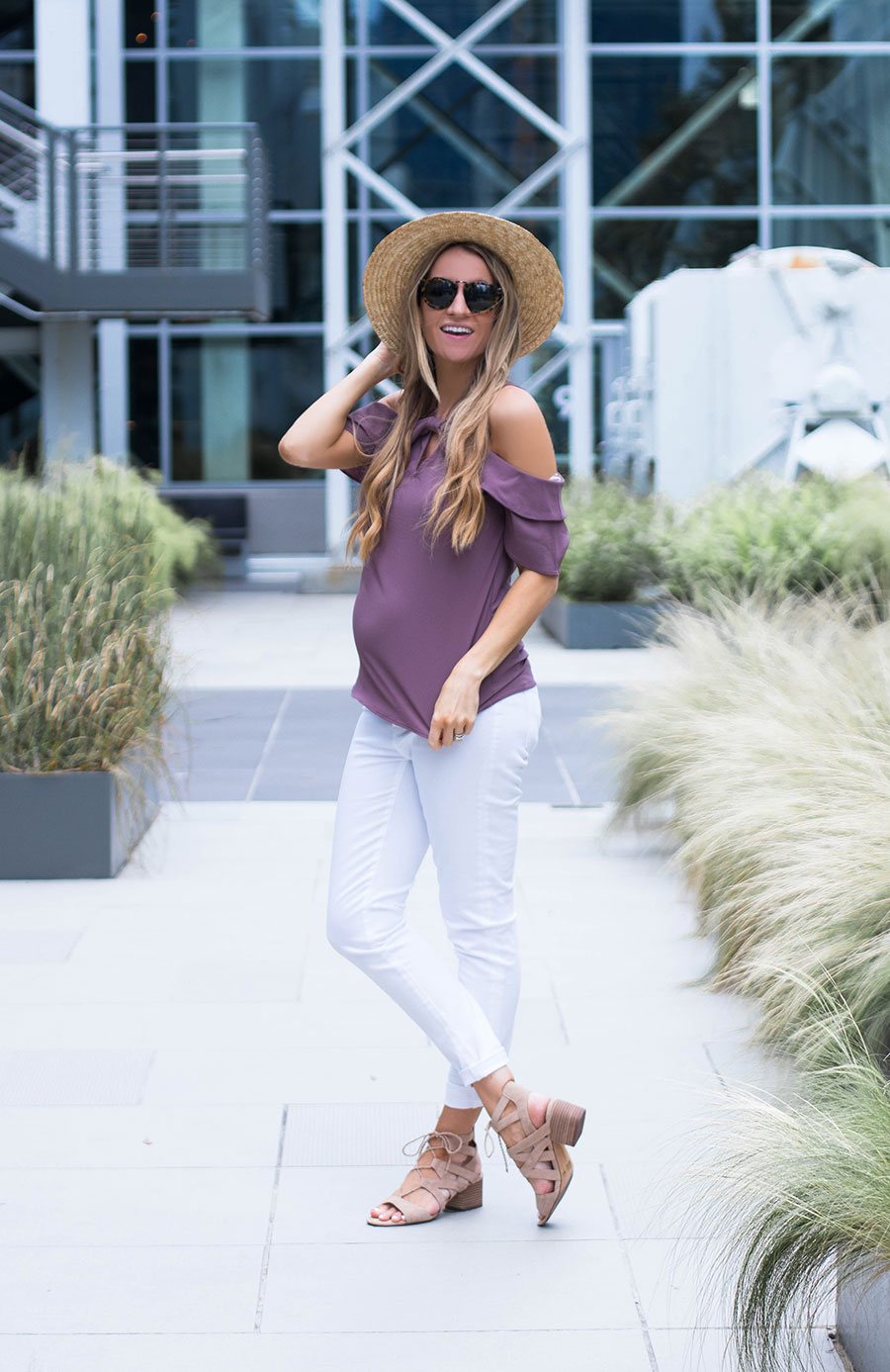 purple off the shoulder top and white jeans